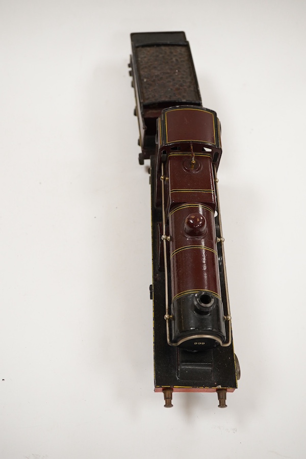 An 0 gauge Bing clockwork tinplate Midland Railway 4-4-0 tender locomotive, 999, in maroon livery with yellow and black lining and original clockwork mechanism